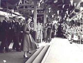 Queen Elizabeth II and the Duke of Edinburgh step off the train at Ballymoney Station